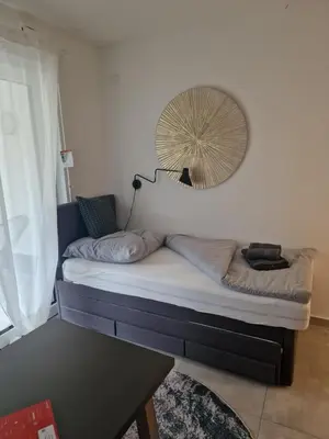 Ein Bett oder Betten in einem Zimmer der Unterkunft Parkside Modernes Studio Appartment
