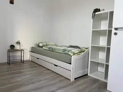 Ein Bett oder Betten in einem Zimmer der Unterkunft Waldnest