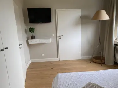 Ein Bett oder Betten in einem Zimmer der Unterkunft Airport-Messe Apartment, fußläufig erreichbar 3