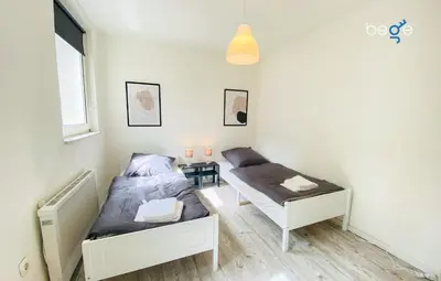 Ein Bett oder Betten in einem Zimmer der Unterkunft SASI HOMES - WorkBase