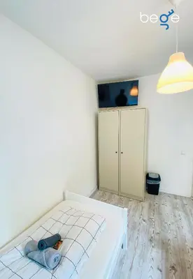 Ein Bett oder Betten in einem Zimmer der Unterkunft SASI HOMES - WorkBase