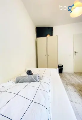 Ein Bett oder Betten in einem Zimmer der Unterkunft SASI HOMES - WorkBase