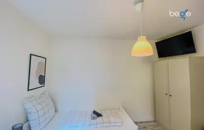 Ein Bett oder Betten in einem Zimmer der Unterkunft SASI HOMES - WorkBase