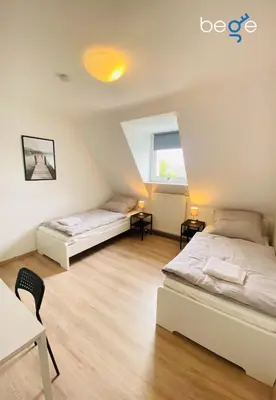 Ein Bett oder Betten in einem Zimmer der Unterkunft SASI HOMES Business Lodge