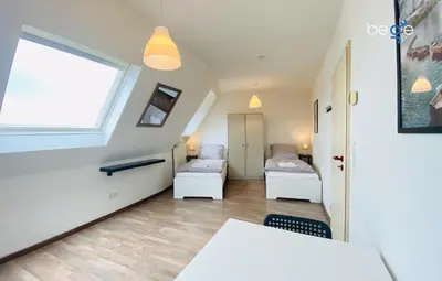 Ein Bett oder Betten in einem Zimmer der Unterkunft SASI HOMES Business Lodge