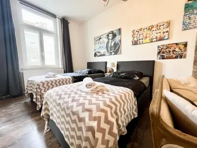 Ein Bett oder Betten in einem Zimmer der Unterkunft NewYork Suite für 4 mit Küche und WIFI