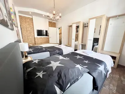 Ein Bett oder Betten in einem Zimmer der Unterkunft NewYork Suite für 4 mit Küche und WIFI