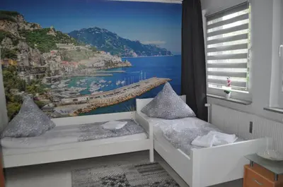 Ein Bett oder Betten in einem Zimmer der Unterkunft Tam Wohnung