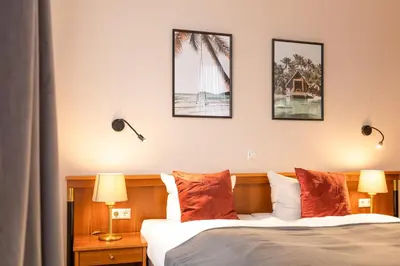 Ein Bett oder Betten in einem Zimmer der Unterkunft Hotel Restaurant Am Park