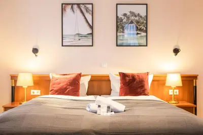 Ein Bett oder Betten in einem Zimmer der Unterkunft Hotel Restaurant Am Park