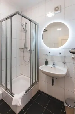 Ein Badezimmer in der Unterkunft Hotel Restaurant Am Park