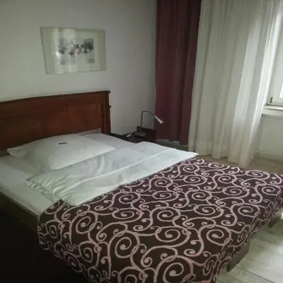 Ein Bett oder Betten in einem Zimmer der Unterkunft Hotel Georg