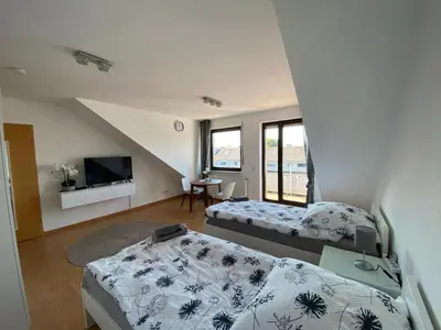 Ein Bett oder Betten in einem Zimmer der Unterkunft Am Quellberg Apartments Recklinghausen