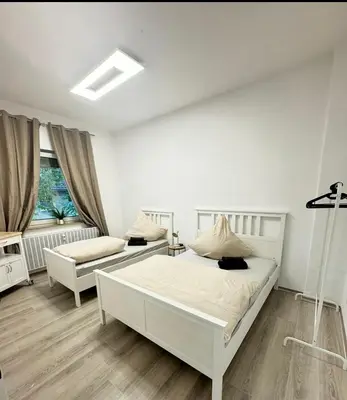 Ein Bett oder Betten in einem Zimmer der Unterkunft Stylish & Relaxing Modernes Apartment mit Privatparkplatz