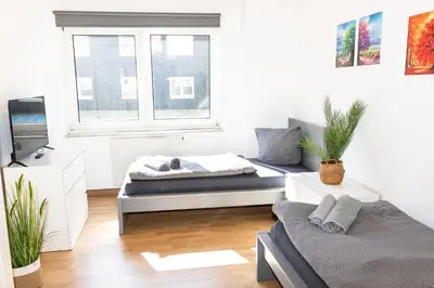 Ein Bett oder Betten in einem Zimmer der Unterkunft CosyHomes24 - Centrally with balcony and parking space - GE09a
