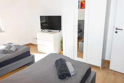 Ein Bett oder Betten in einem Zimmer der Unterkunft CosyHomes24 - Centrally with balcony and parking space - GE09a