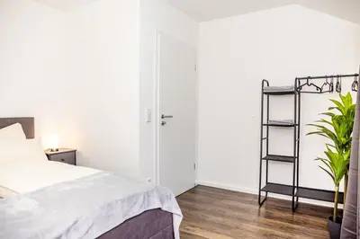 Ein Bett oder Betten in einem Zimmer der Unterkunft FEEL - Comfort Haus Münsterblick - Nahe Münster