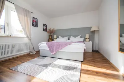 Ein Bett oder Betten in einem Zimmer der Unterkunft Dortmunder Erdgeschoss-Luxusloft mit großen Balkon, Netflix und 250 Mbytes Highspeed Wifi
