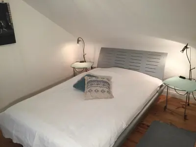 Ein Bett oder Betten in einem Zimmer der Unterkunft Fabrikantenvilla