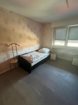 Ein Bett oder Betten in einem Zimmer der Unterkunft Red Dot Eva