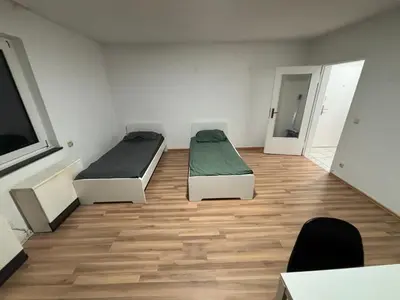 Ein Bett oder Betten in einem Zimmer der Unterkunft Speedstay - Essen Apartment
