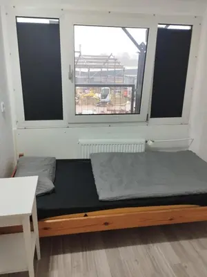 Ein Bett oder Betten in einem Zimmer der Unterkunft Speedstay - Essen Apartment