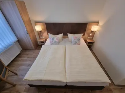 Ein Bett oder Betten in einem Zimmer der Unterkunft Gästehaus Grunewald Bed & Breakfast