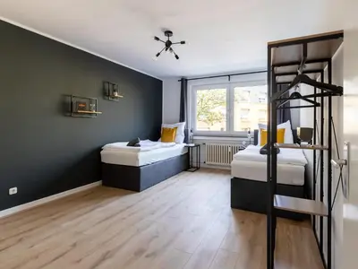 Ein Bett oder Betten in einem Zimmer der Unterkunft Zentrales Apartment Essen Kaffeevollautomat Parkplatz