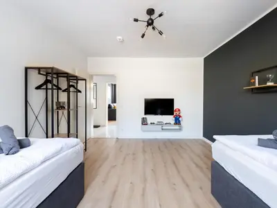 Ein Bett oder Betten in einem Zimmer der Unterkunft Zentrales Apartment Essen Kaffeevollautomat Parkplatz