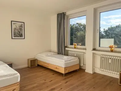 Ein Bett oder Betten in einem Zimmer der Unterkunft T&K Apartments - Düsseldorf - 3 room apartment with private parking 7min Fair and Airport DUS