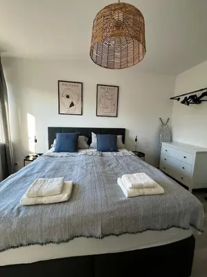 Ein Bett oder Betten in einem Zimmer der Unterkunft Gemütliche Wohnung nahe Messe und Flughafen