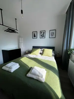 Ein Bett oder Betten in einem Zimmer der Unterkunft Gemütliche Wohnung nahe Messe und Flughafen