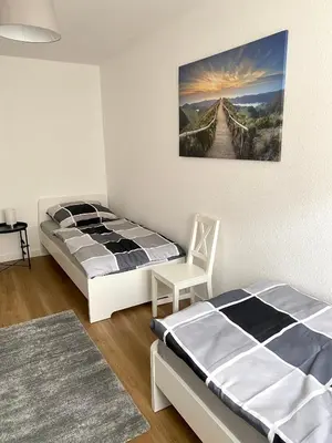 Ein Bett oder Betten in einem Zimmer der Unterkunft Spacious 3-Bed Apartment WiFi, Netflix, Self Check-in