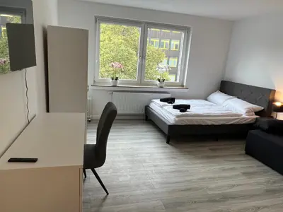 Ein Bett oder Betten in einem Zimmer der Unterkunft Business Apartment 13 Essen