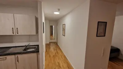 Küche/Küchenzeile in der Unterkunft Moderne, barrierefreie Wohnung im Herzen der Stadt mit Parkplatz, WLAN und TV - Marta