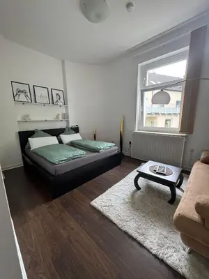 Ein Bett oder Betten in einem Zimmer der Unterkunft Seibel's SUITES - Appartement Wohnung mitten in Rüttenscheid