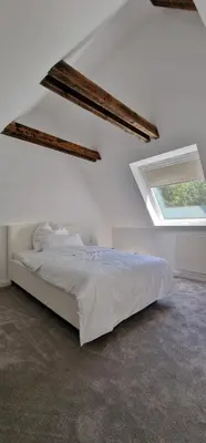 Ein Bett oder Betten in einem Zimmer der Unterkunft Ruhiges Haus mit Whirlpool für 5 Gäste nahe Messe Essen mit 3 Schlafzimmern