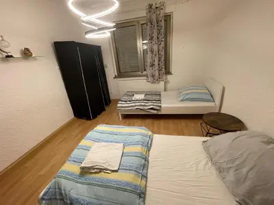 Ein Bett oder Betten in einem Zimmer der Unterkunft MAD Ferienwohnungen 1