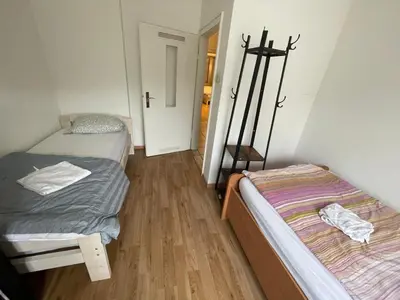 Ein Bett oder Betten in einem Zimmer der Unterkunft MAD Ferienwohnungen 1
