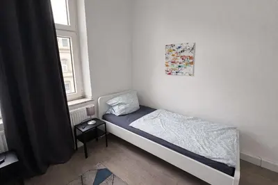 Ein Bett oder Betten in einem Zimmer der Unterkunft Monteurwohnungen Essen Kudox Living