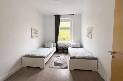 Ein Bett oder Betten in einem Zimmer der Unterkunft Monteurwohnungen Essen Kudox Living