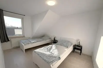 Ein Bett oder Betten in einem Zimmer der Unterkunft Monteurwohnungen Essen Kudox Living