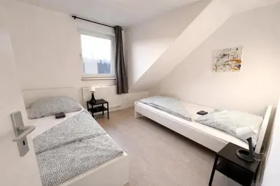Ein Bett oder Betten in einem Zimmer der Unterkunft Monteurwohnungen Essen Kudox Living