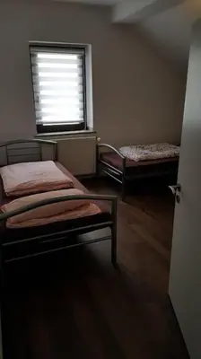 Ein Bett oder Betten in einem Zimmer der Unterkunft Ferienwohnung Heiligenhaus-powered by Çelik