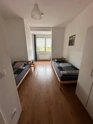 Ein Bett oder Betten in einem Zimmer der Unterkunft Ferien- Monteurapartments nähe Veltins Arena