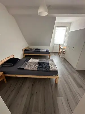 Ein Bett oder Betten in einem Zimmer der Unterkunft Ferien- Monteurapartments nähe Veltins Arena