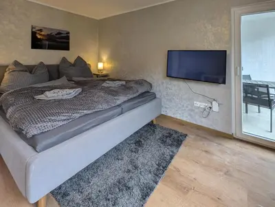 Ein Bett oder Betten in einem Zimmer der Unterkunft H-Aparts Essen - TOP Apartments in Best-Lage