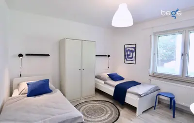 Ein Bett oder Betten in einem Zimmer der Unterkunft BEGE APARTMENTS Company Base