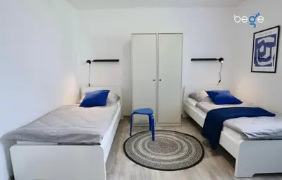 Ein Bett oder Betten in einem Zimmer der Unterkunft BEGE APARTMENTS Company Base