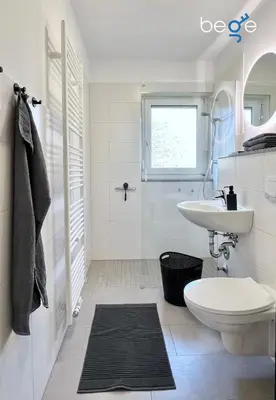 Ein Badezimmer in der Unterkunft BEGE APARTMENTS Company Base